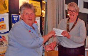 Pam Joyce of Disaster Aid UK receives a cheque for £2,700, the proceeds of our collections, personal donations and club donations.